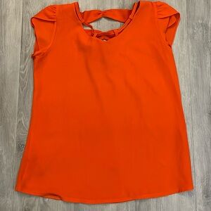 Shortsleeve blouse with cool tie back & looped neckline